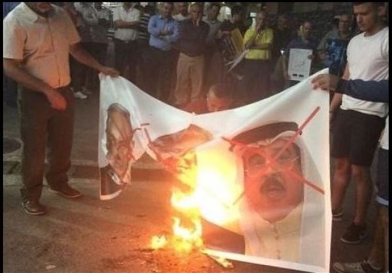 آتش زدن عکس شاه بحرین، ترامپ و نتانیاهو